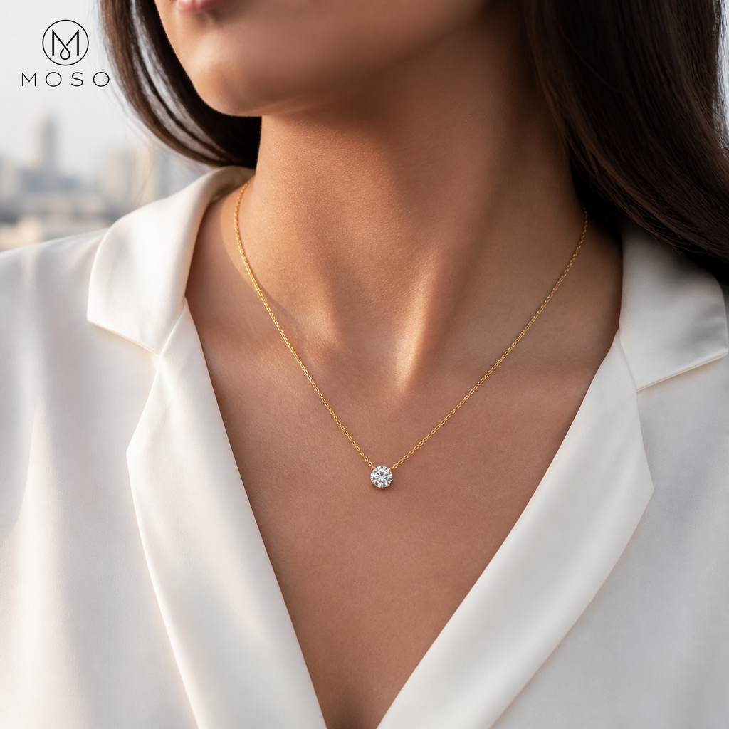 Woman wearing Abigail gold tone moissanite solitaire necklace