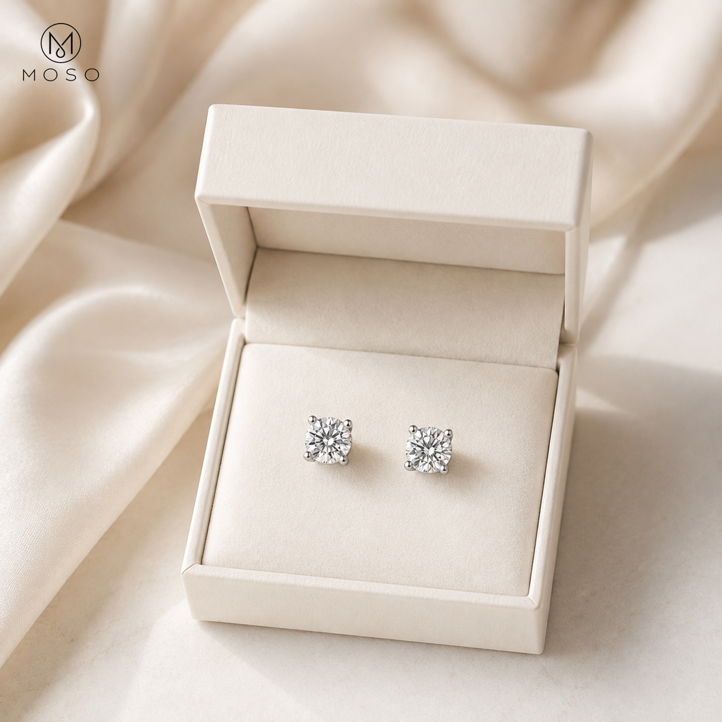 Amelia round moissanite stud earrings in an ivory gift box