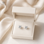 Amelia round moissanite stud earrings in an ivory gift box