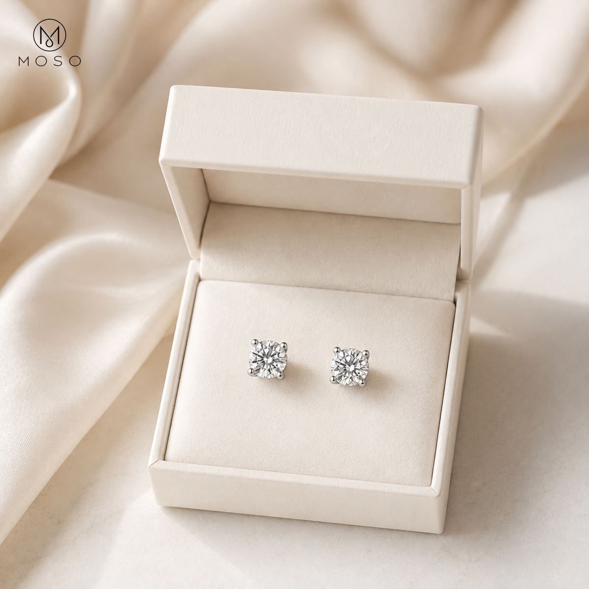 Amelia round moissanite stud earrings in an ivory gift box