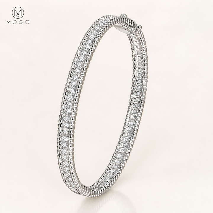 Aria silver tone 2mm moissanite bangle on ivory background