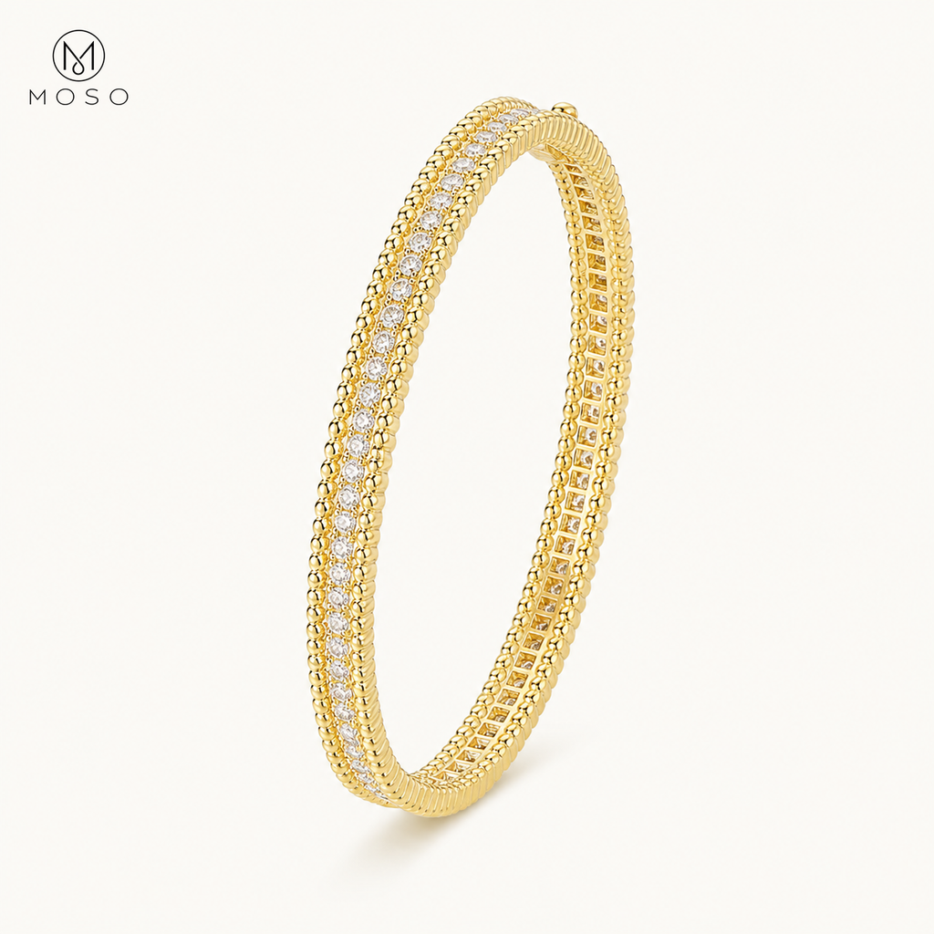 Aria gold tone 2mm moissanite bangle on ivory background