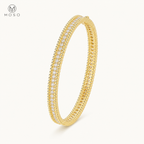 Aria gold tone 2mm moissanite bangle on ivory background