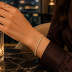 Aria gold tone moissanite bangle worn on wrist