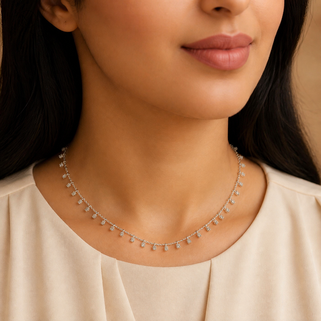 Woman wearing Aurora 3 mm moissanite drop station necklace
