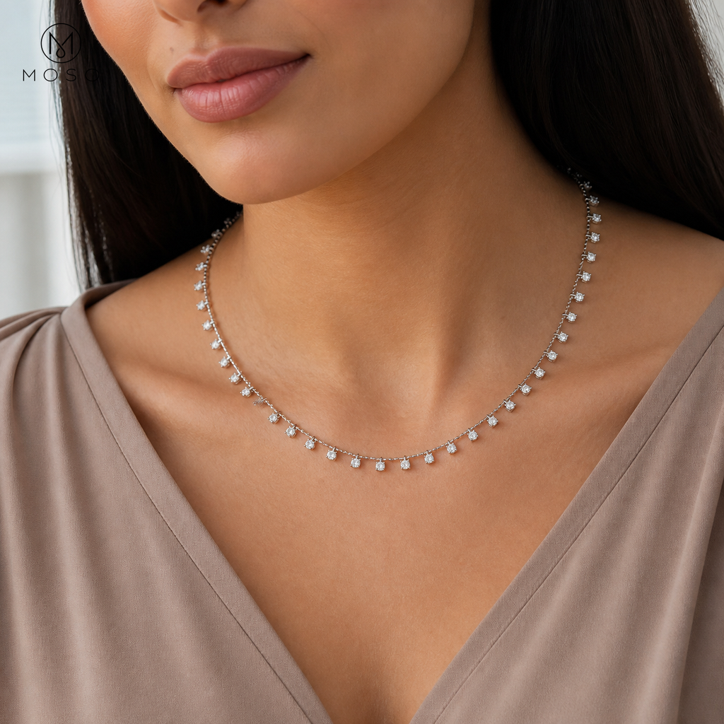 Woman wearing Aurora 4 mm moissanite station necklace