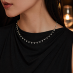 Aurora 3 mm moissanite necklace styled with black evening dress