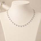 Aurora 3 mm moissanite station necklace displayed on ivory bust