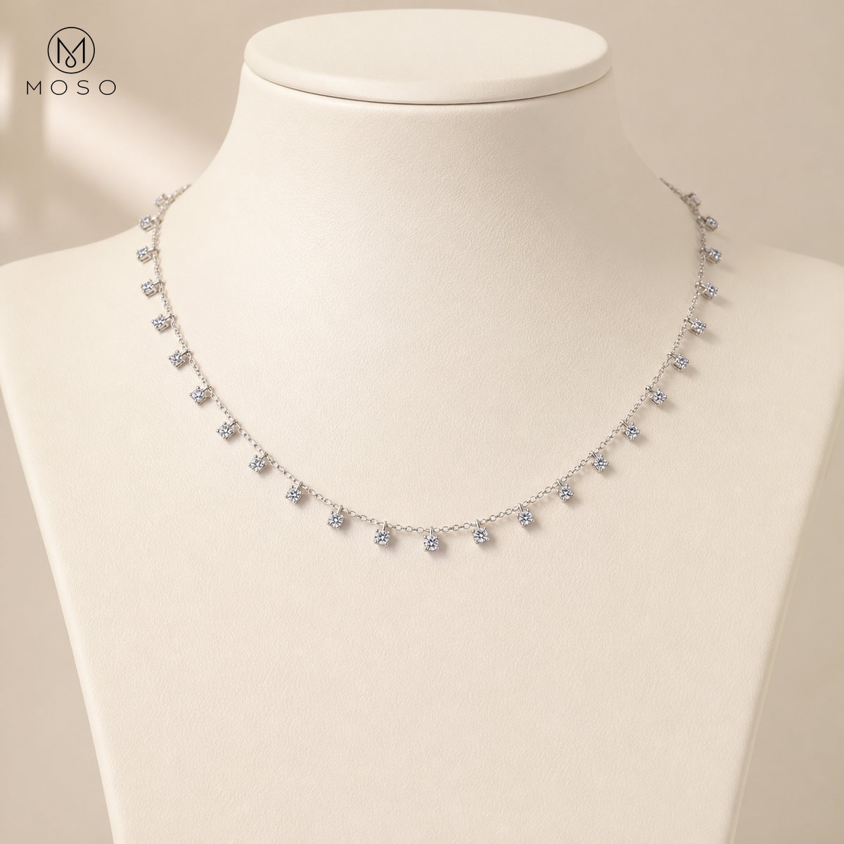 Aurora 3 mm moissanite station necklace displayed on ivory bust
