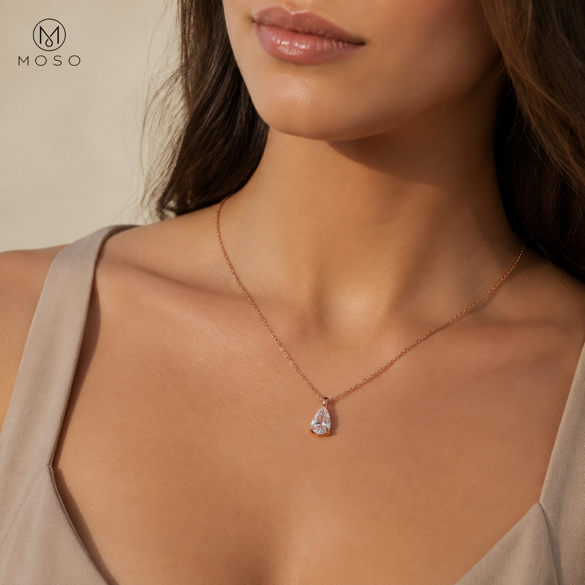 Ava rose gold tone pear cut moissanite necklace worn in daylight