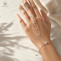 Brooklyn silver colour pear cut moissanite hand chain bracelet worn on hand