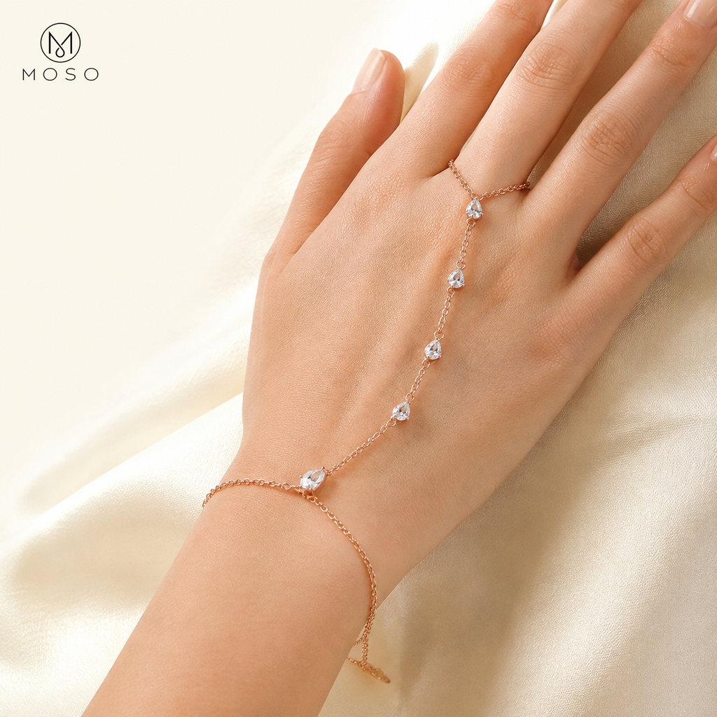 Brooklyn rose gold colour pear cut moissanite hand chain bracelet worn on hand