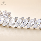 Macro of Camila 4 by 8 mm marquise moissanite stones