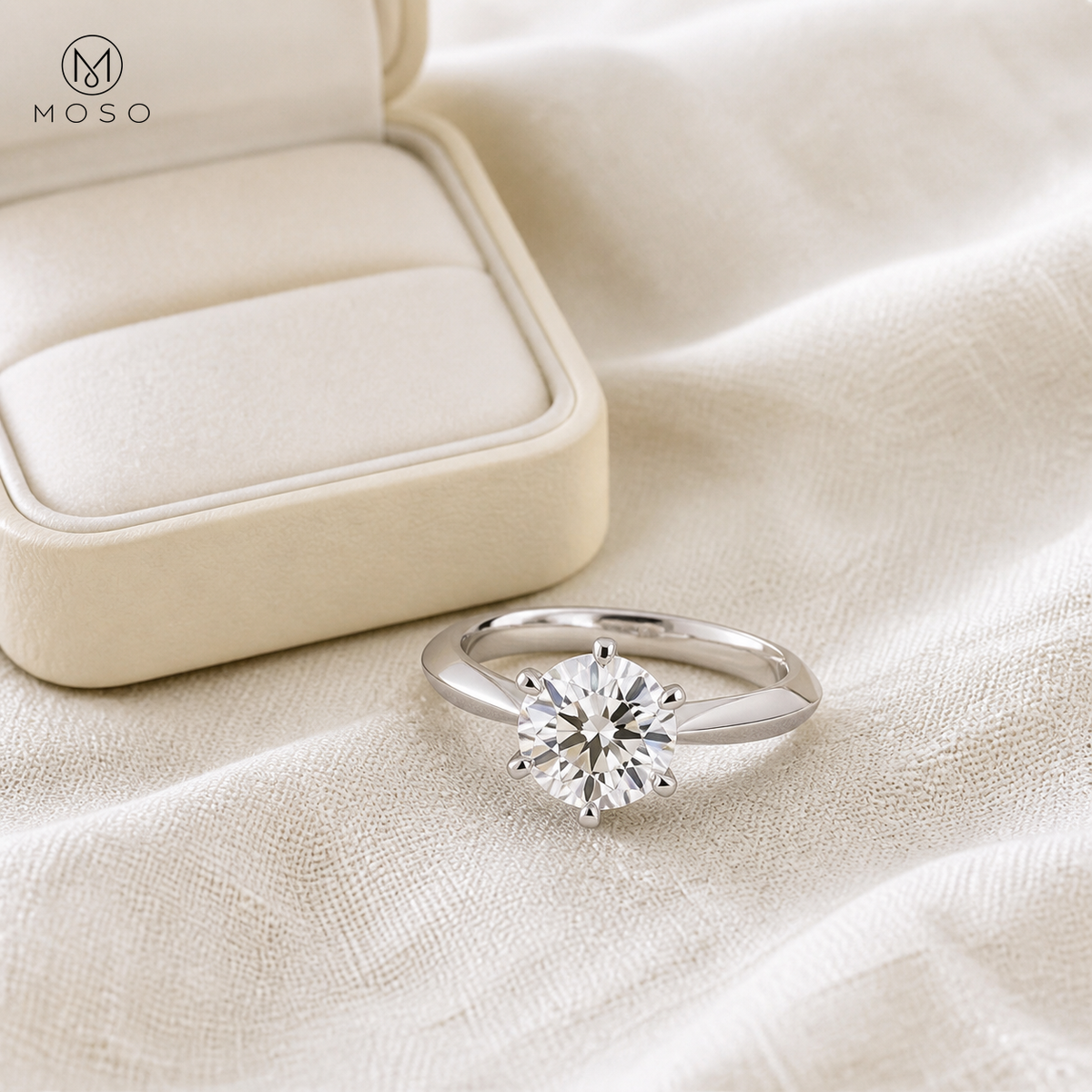 Charlotte round moissanite solitaire ring with ivory jewellery box