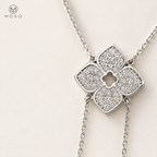Close view of the Chloe four petal moissanite necklace centerpiece
