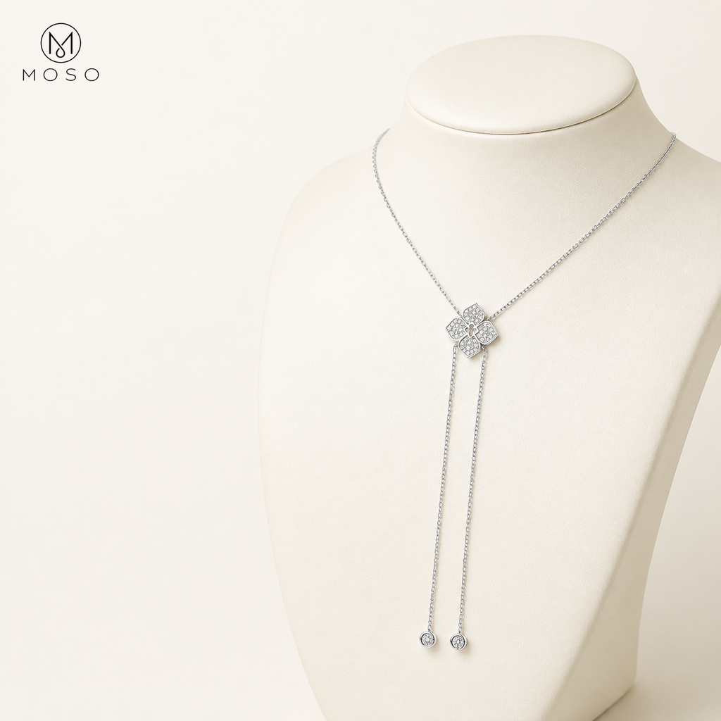 Chloe moissanite lariat necklace shown on an ivory display bust