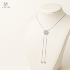Chloe moissanite lariat necklace shown on an ivory display bust