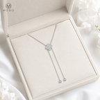 Chloe moissanite lariat necklace presented in an ivory gift box