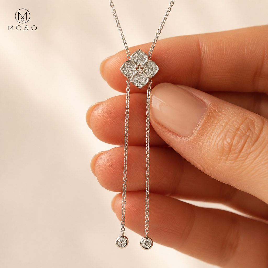 Chloe moissanite lariat necklace held to show centerpiece and drop detail