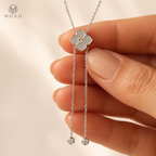 Chloe moissanite lariat necklace held to show centerpiece and drop detail