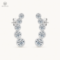 Eliana compact silver moissanite graduated drop earrings on ivory