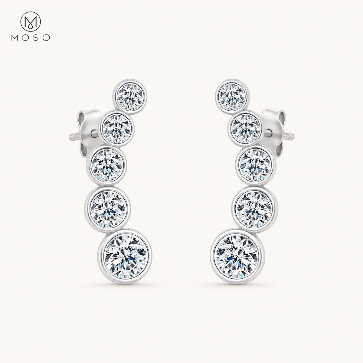Eliana compact silver moissanite graduated drop earrings on ivory