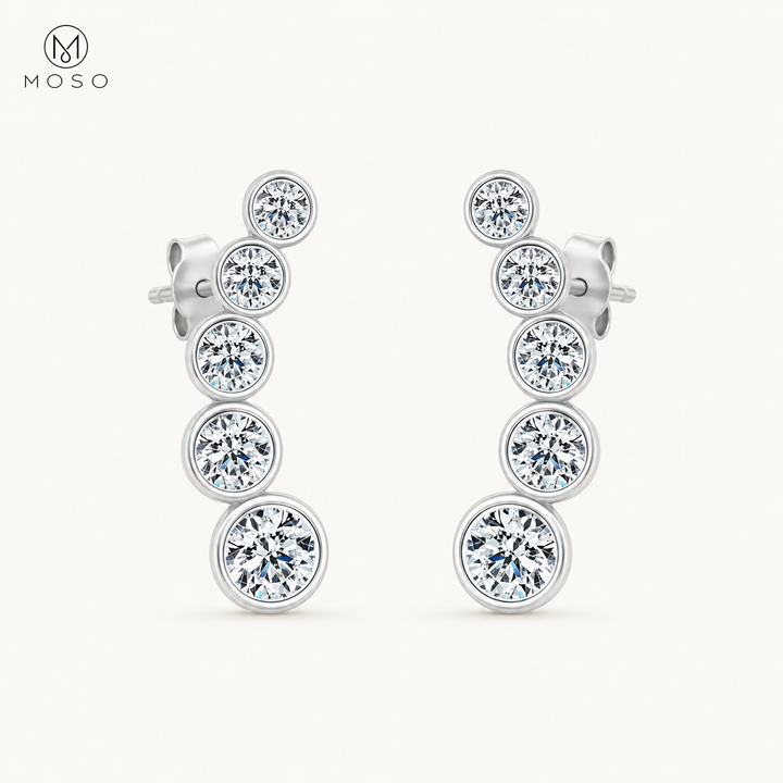 Eliana compact silver moissanite graduated drop earrings on ivory