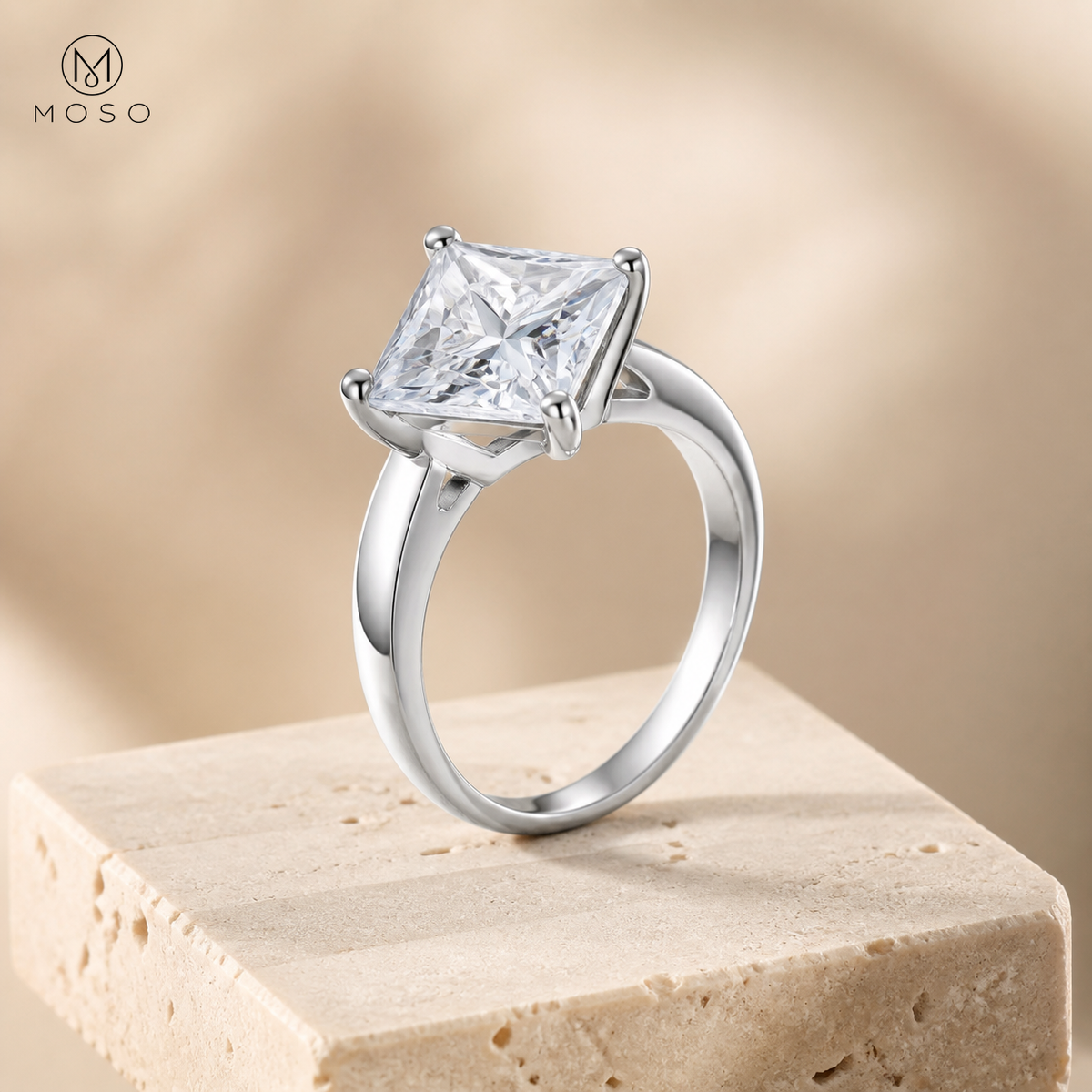 Ella princess cut solitaire ring on beige pedestal