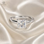 Ella princess cut moissanite ring on ivory satin