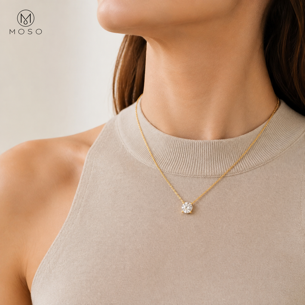Emily gold colour round moissanite necklace worn with a neutral top