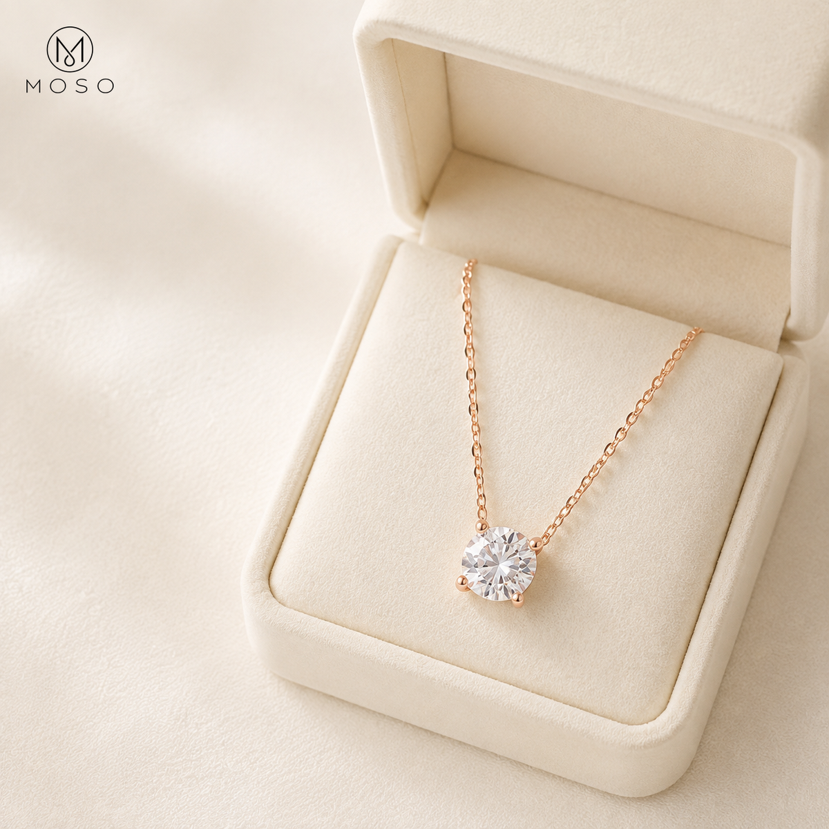 Emily rose gold colour moissanite necklace in an ivory gift box