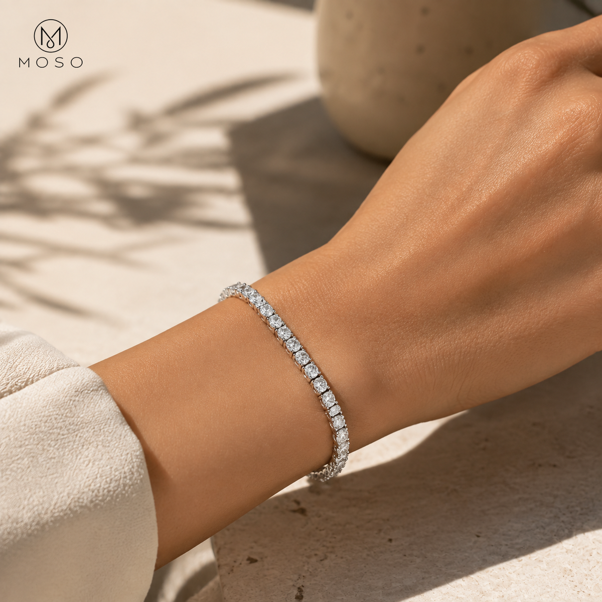 Emma rhodium plated moissanite tennis bracelet worn in daylight