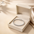 Emma round moissanite tennis bracelet in an ivory gift box