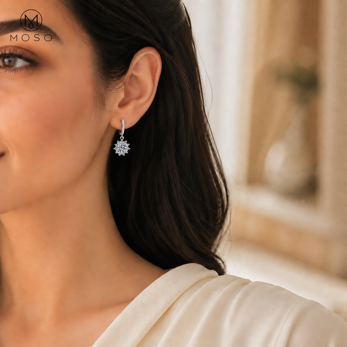 Woman wearing Evelyn round moissanite halo drop earring, styled in the UAE | MOSO