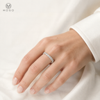 Hailey full eternity moissanite wedding band worn on an adult hand