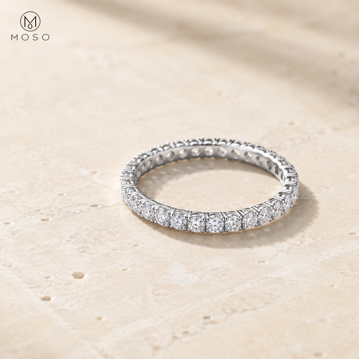 Hailey delicate 2mm round moissanite full eternity ring on pale stone