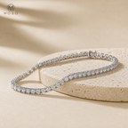 Hannah silver tennis bracelet on beige pedestal