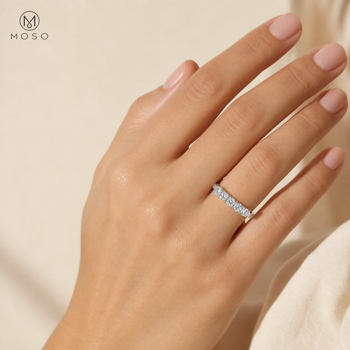 Woman wearing Harper clear moissanite wedding band