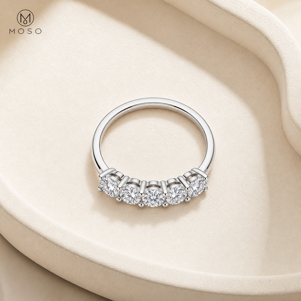 Harper clear moissanite five stone wedding band top view