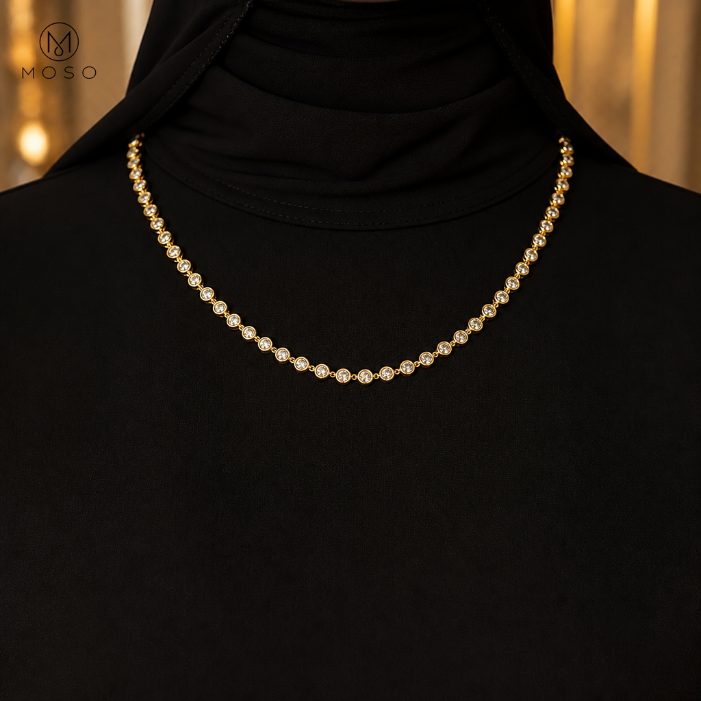 Hazel gold tone moissanite necklace styled with black