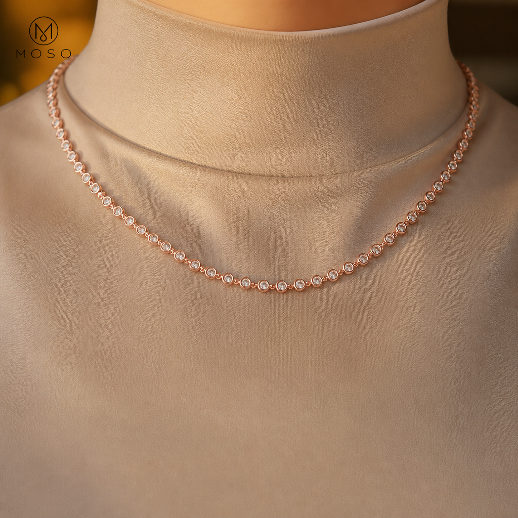 Hazel rose gold tone moissanite necklace on sand silk