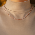 Hazel rose gold tone moissanite necklace on sand silk
