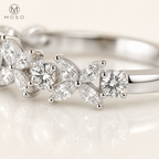 Macro view of Isabella marquise petal and round moissanite setting