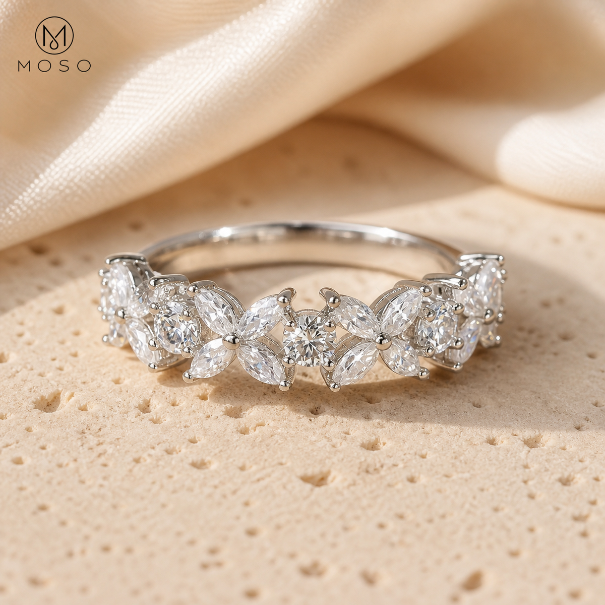 Isabella floral moissanite band on warm ivory stone