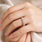 Woman wearing Isabella marquise moissanite band