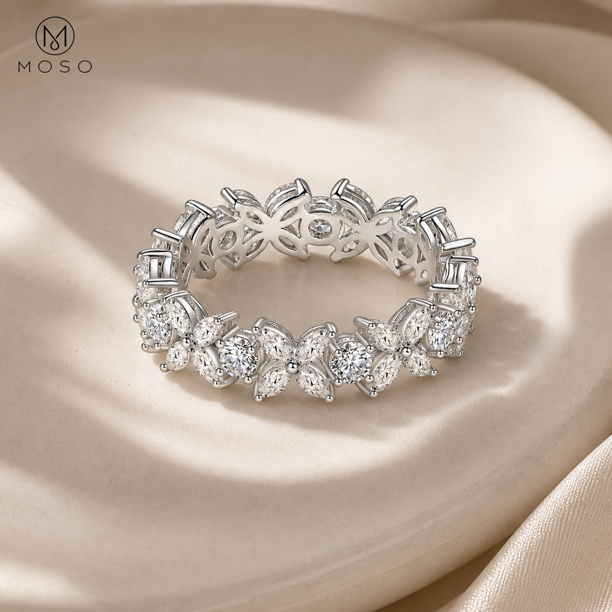 Isabella silver moissanite floral band on ivory ceramic