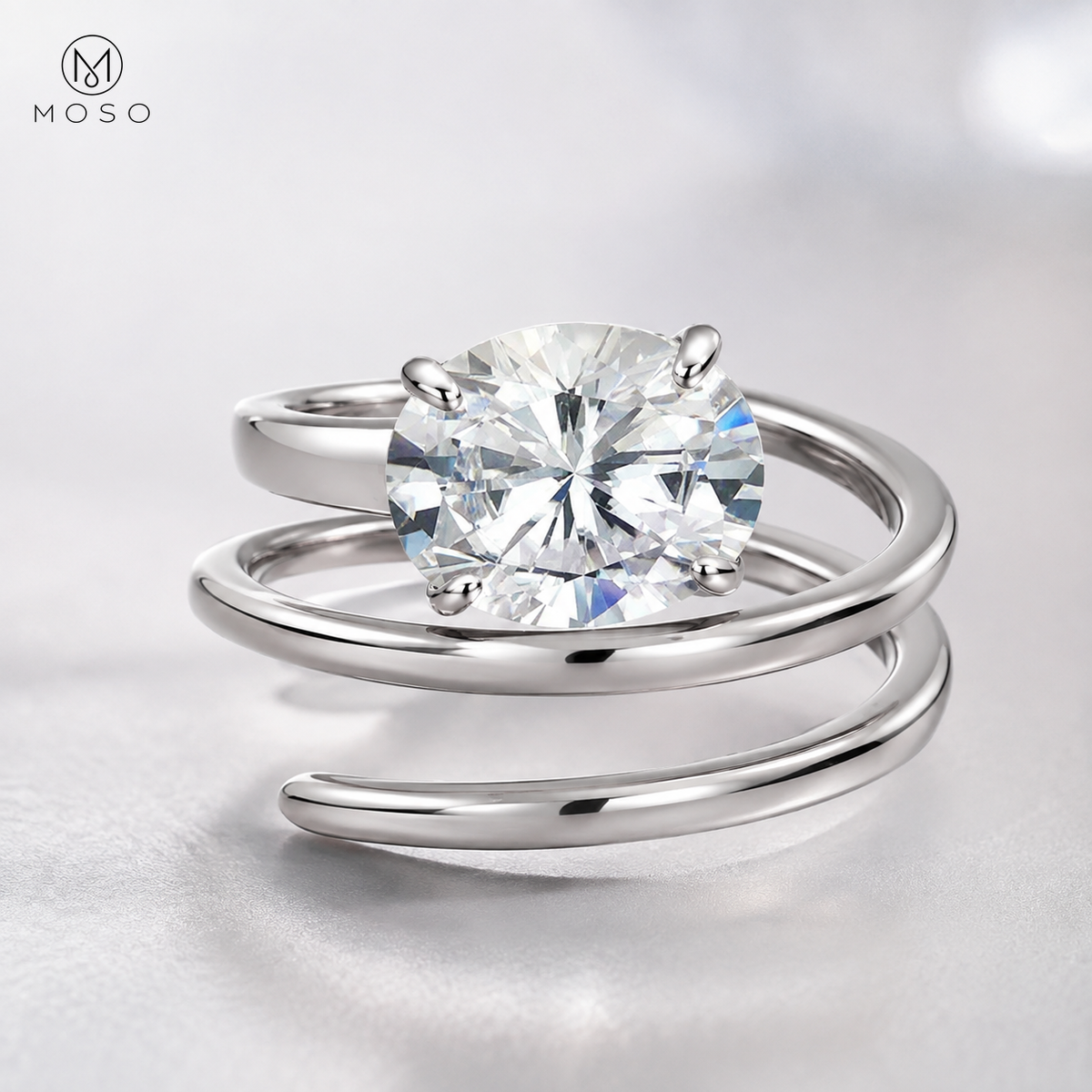 Jessica round moissanite four prong setting and spiral band detail