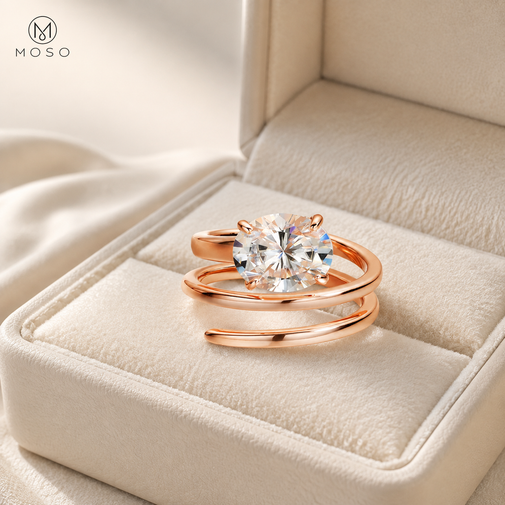 Jessica rose gold tone round moissanite spiral ring in an ivory jewellery box