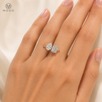Kennedy pear and emerald moissanite ring worn on hand