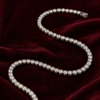 Layla clear moissanite tennis necklace on burgundy velvet